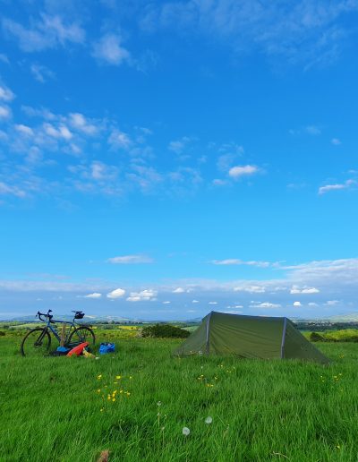 Bike next to small tent in the Top Field