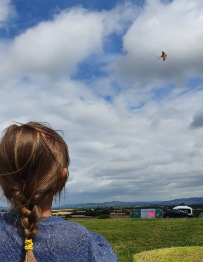 Young girl flying a kite