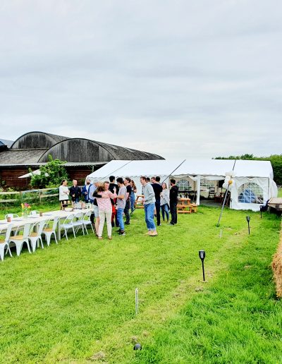 Guests gather for evening drinks in the Top Field